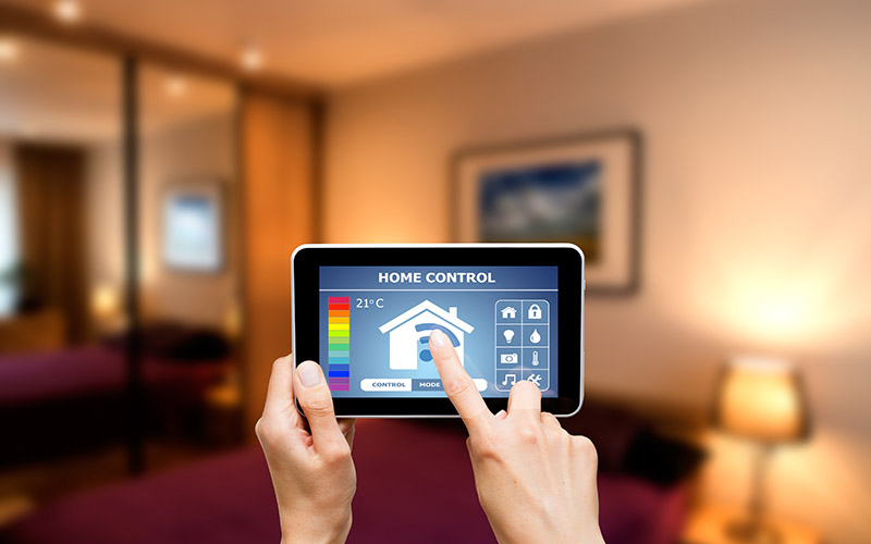 person using app for smart thermostat on tablet